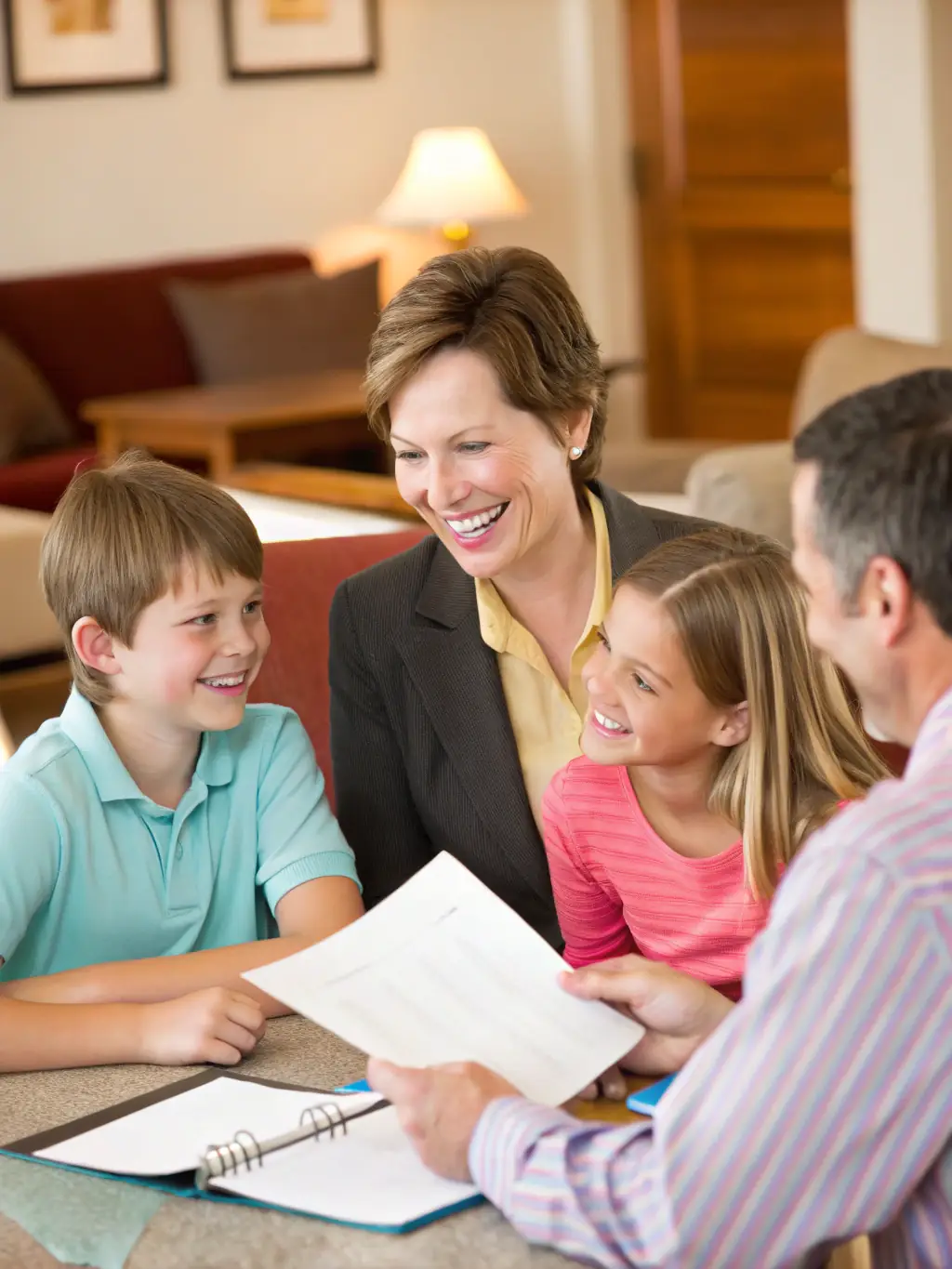 An image of a family discussing financial plans with a tax advisor in a modern home setting, emphasizing family tax planning.