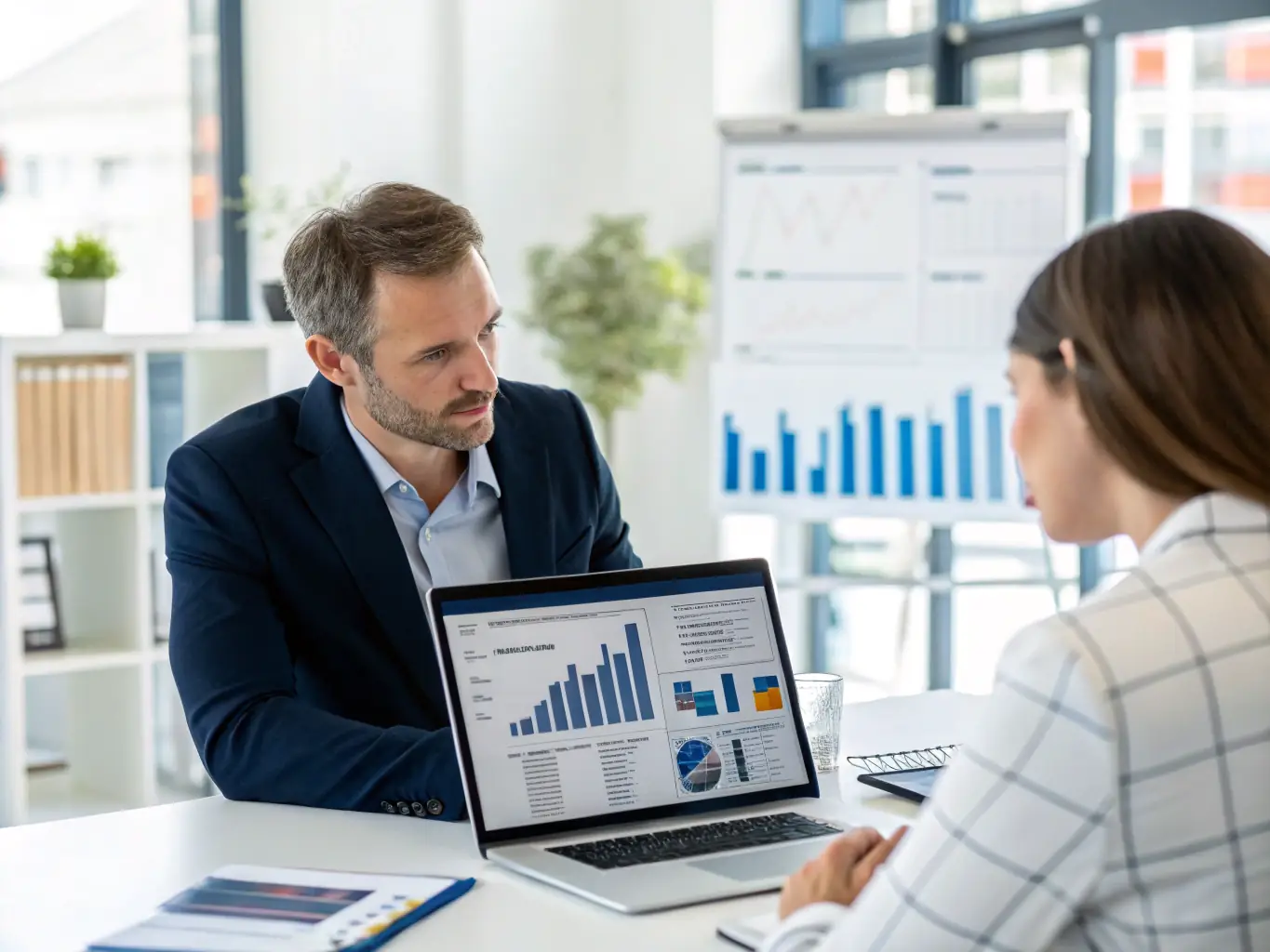 A professional financial advisor reviewing tax documents in a modern office setting, symbolizing tax optimization.